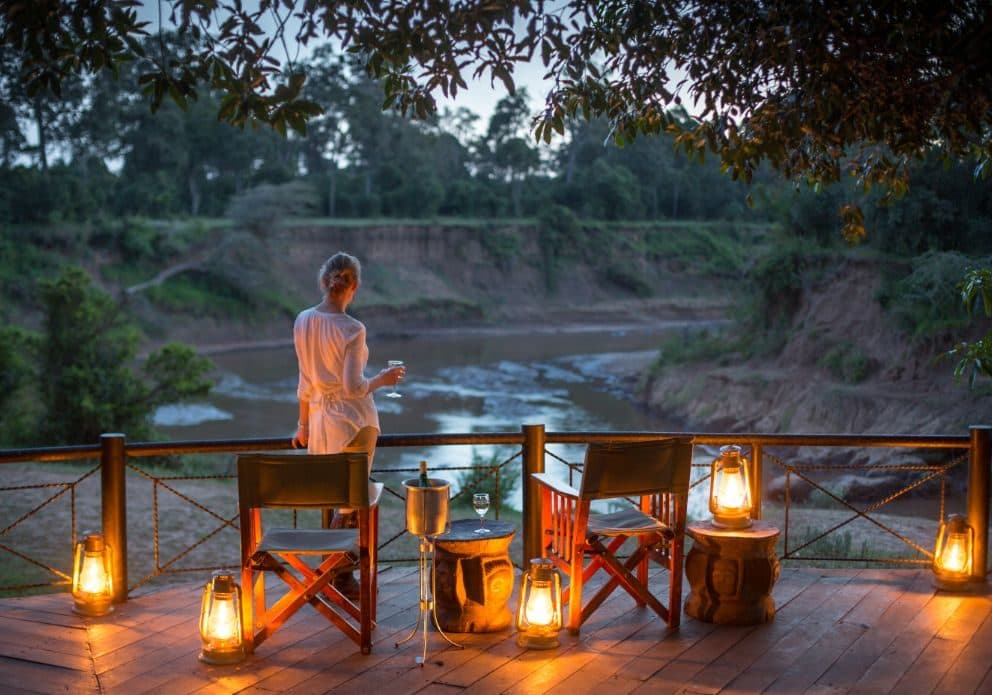 The exterior of a classic tented safari camp in the bush.